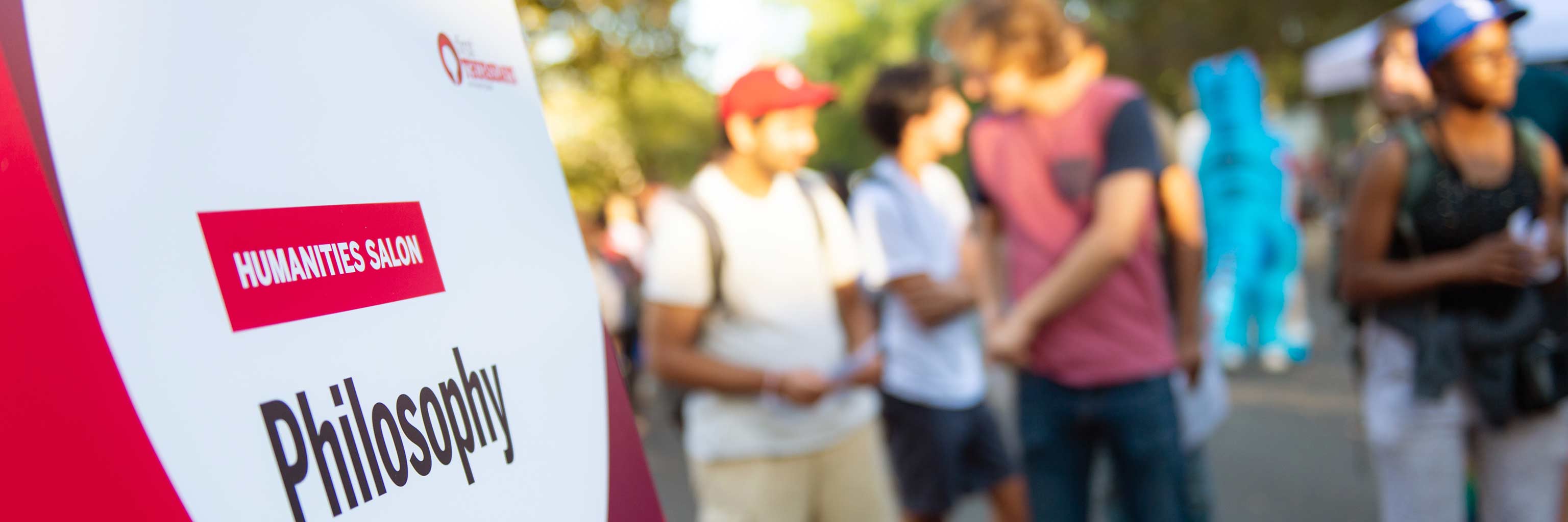 Close up of a sign for the philosophy booth at the First Thursdays festival.