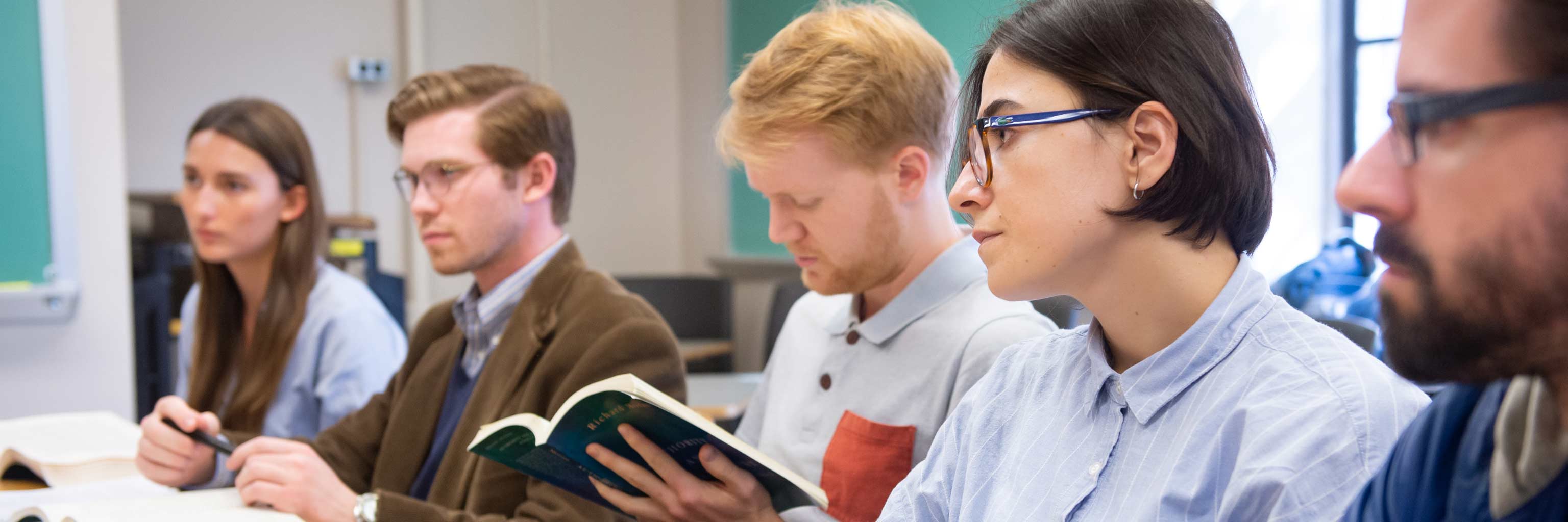 A row of students engaged during class.