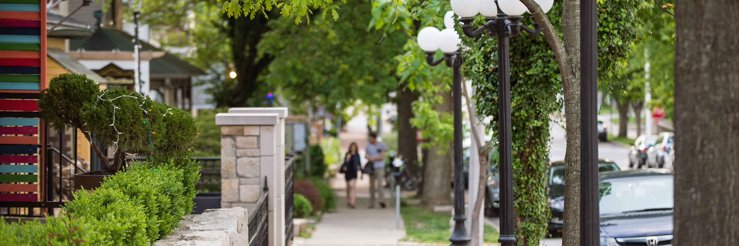 A couple walking along Fourth Street in downtown Bloomington.