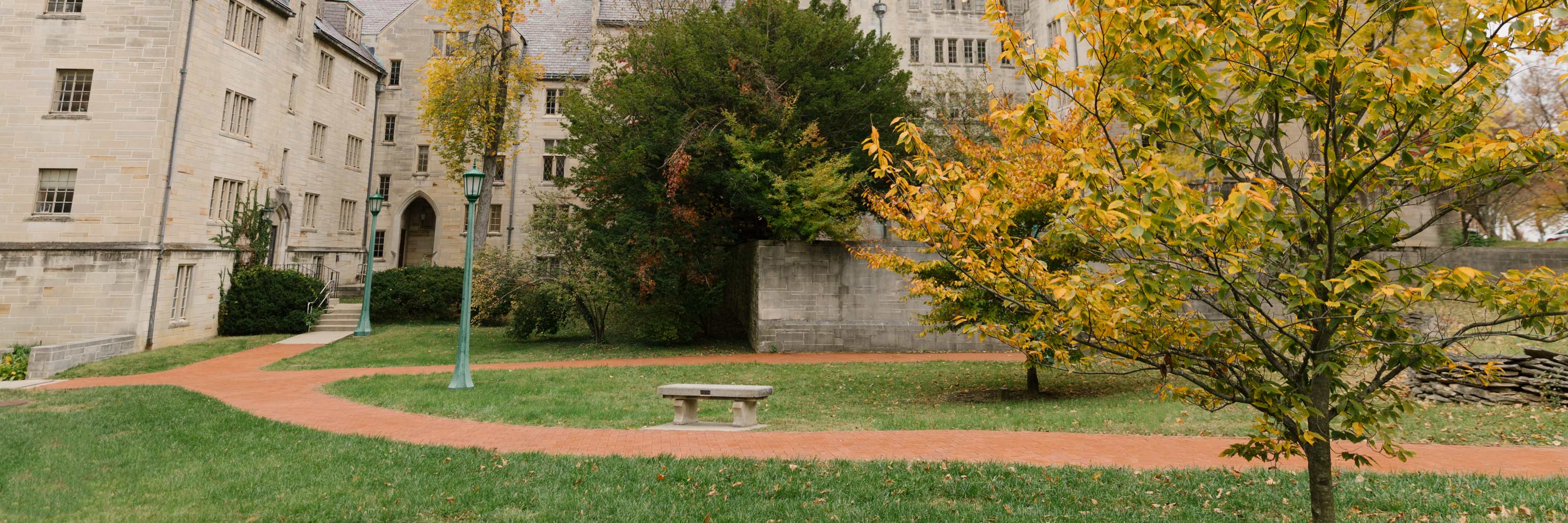 A brick path running in front of Sycamore Hall.