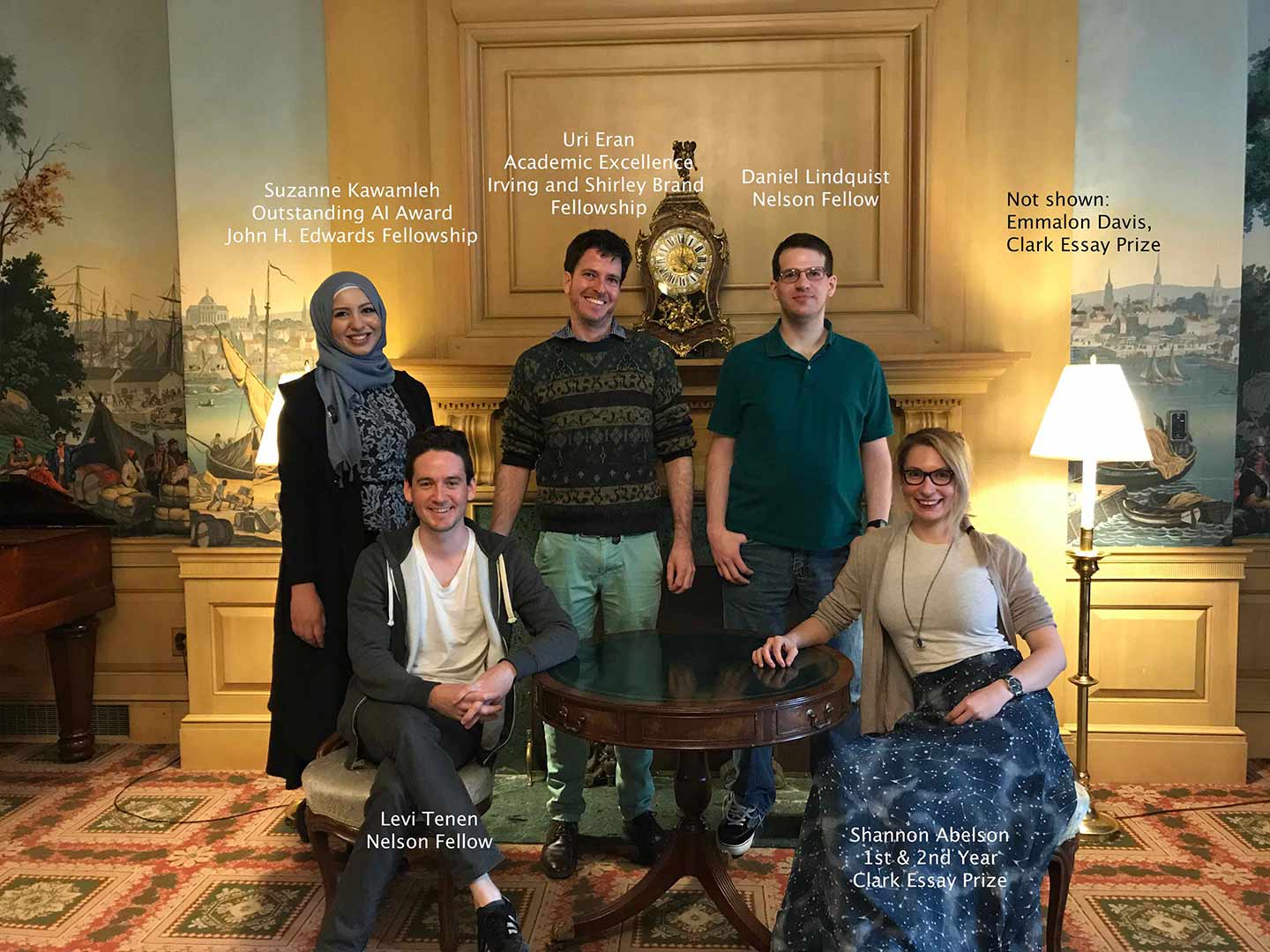 Graduate students standing in a hall